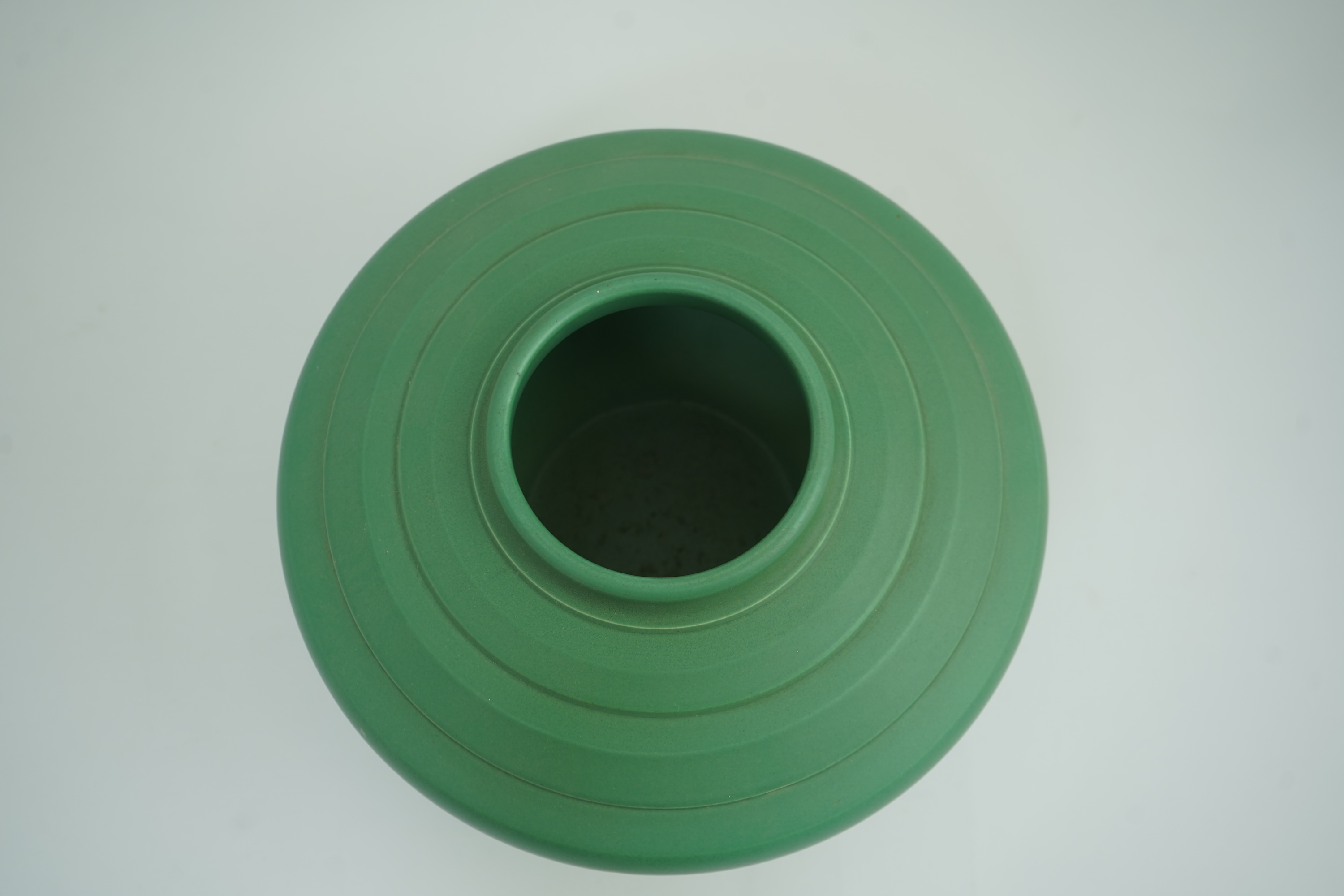 Keith Murray MC RDI FRIBA (New Zealand/British, 1892-1981) for Wedgwood: A matt green glazed angular vase